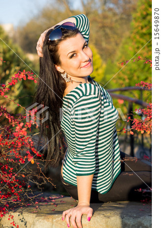 Young pretty woman in autumn park Young pretty woman in autumn park 15649870