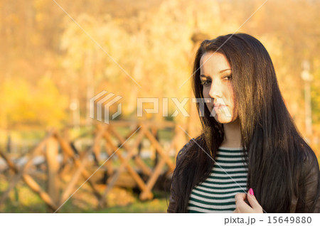 beautiful and sexy girl sitting on bench outdoors beautiful and sexy girl sitting on bench outdoors 15649880
