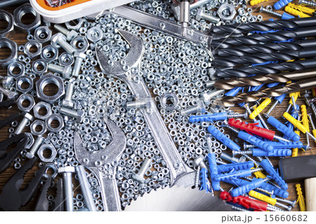 Assorted work tools on wood background 15660682