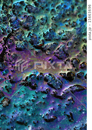 Color gasoline fuel spot on black asphalt 15663696