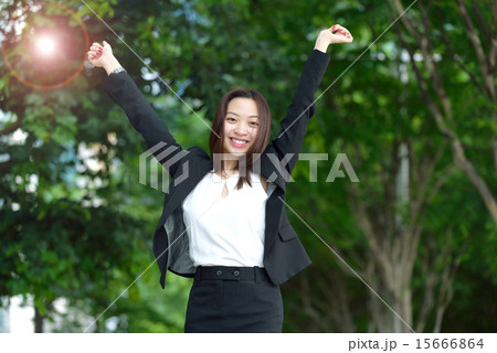 Successful Chinese businesswoman raise arms 15666864