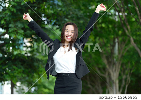 Successful Chinese businesswoman raise arms 15666865