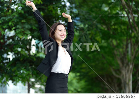 Successful Chinese businesswoman raise arms 15666867