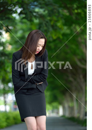 Chinese businesswoman having stomachache Chinese businesswoman having stomachache 15666893