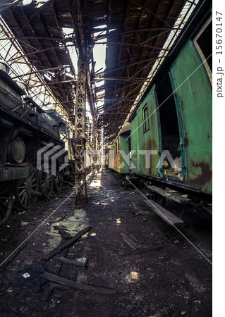 Old trains at abandoned train depot 15670147