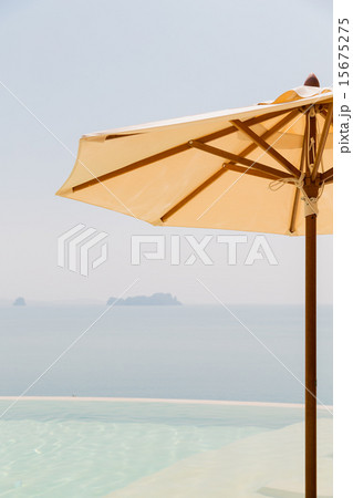 view from infinity edge pool with parasol to sea 15675275