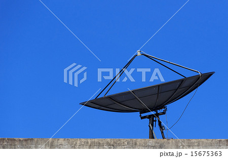 Satellite Dish with Blue Sky on Roof Satellite Dish with Blue Sky on Roof 15675363