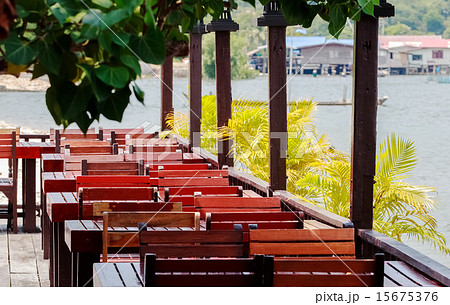 Wooden Tables and Chairs at a open Terrace 15675376