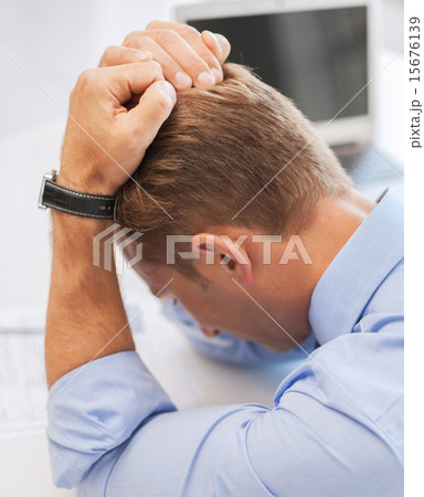 stressed businessman at work 15676139