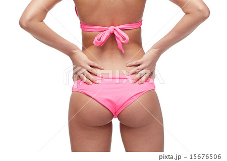 close up of young woman buttocks in pink bikini close up of young woman buttocks in pink bikini 15676506