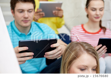 close up of students with tablet pc at school 15676680