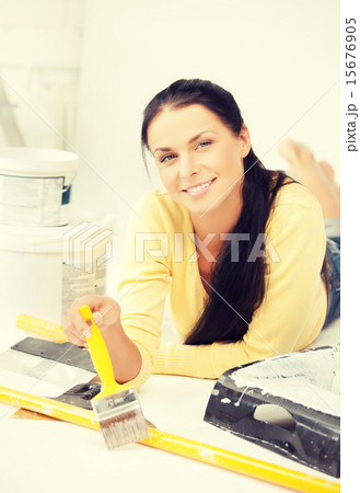 woman with paintbrush and renovating tools 15676905