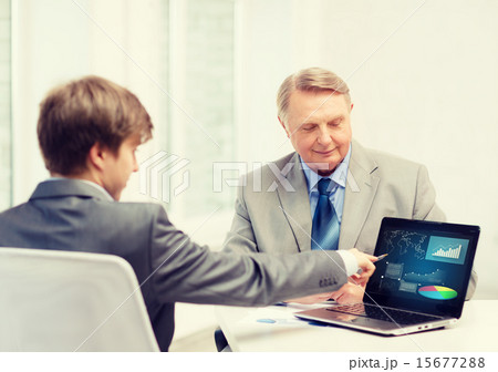 older man and young man with laptop computer older man and young man with laptop computer 15677288