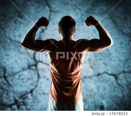 young man or bodybuilder showing biceps 15678023