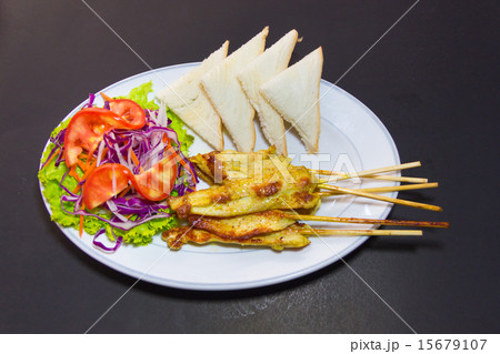 grilled pork satay with peanut sauce and vinegar 15679107