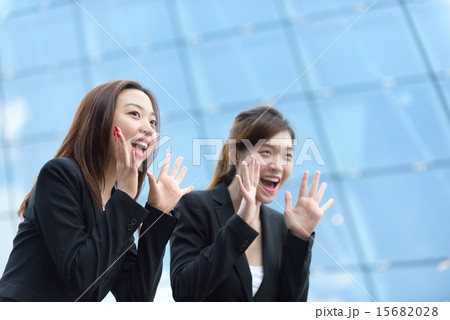 2 Chinese businesswoman shouting good luck 2 Chinese businesswoman shouting good luck 15682028