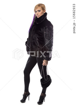 Photo of woman in short fur coat with handbag 15682933