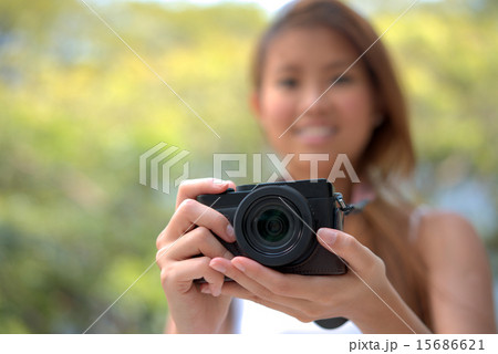 Young asian chinese girl with her photography hobby Young asian chinese girl with her photography hobby 15686621