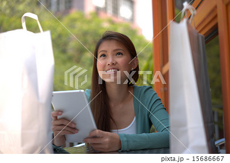 Young asian girl doing online shopping 15686667