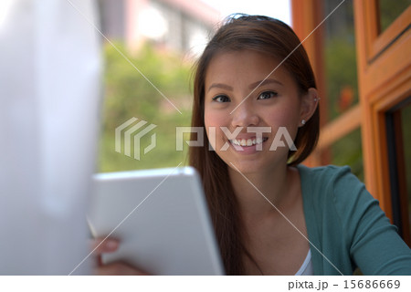 Young asian girl doing online shopping Young asian girl doing online shopping 15686669