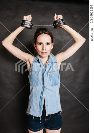 Arrest and jail. Criminal woman prisoner girl in handcuffs Arrest and jail. Criminal woman prisoner girl in handcuffs 15690104