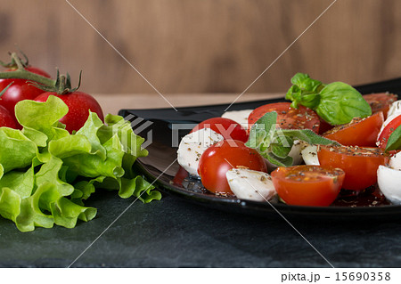 Caprese salad with cherry tomatoes 15690358