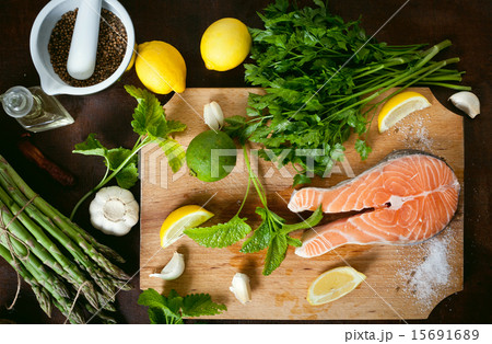 Salmon and spices on wooden table. Top view 15691689