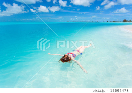 Woman floating on a back in the beautiful sea 15692473