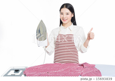young housewife ironing young housewife ironing 15693839