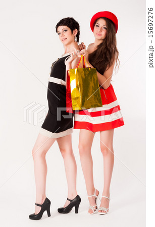 Two Pretty girls holding shopping bags 15697276