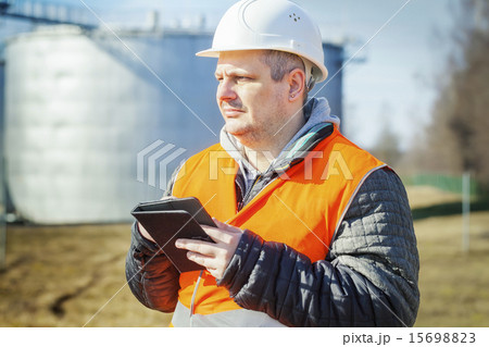 Engineer working with tablet PC in the factory Engineer working with tablet PC in the factory 15698823