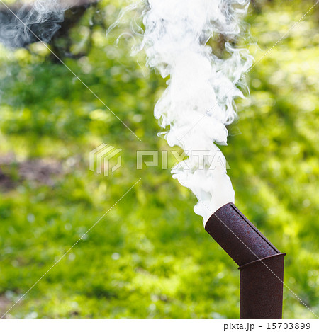 smoke from chimney of samovar on backyard 15703899