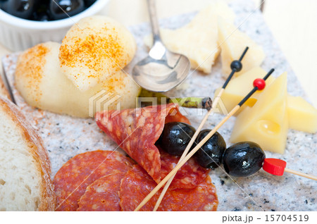 mix cold cut on a stone with fresh pears 15704519