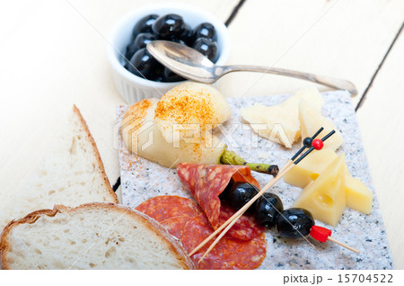 mix cold cut on a stone with fresh pears mix cold cut on a stone with fresh pears 15704522