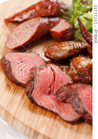 sausages on a wooden cutting board 15711155