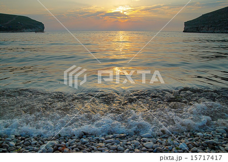 Sunset on the sea with the waves. 15717417