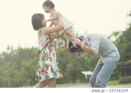 asian family playing and enjoying quality time outdoor asian family playing and enjoying quality time outdoor 15718129