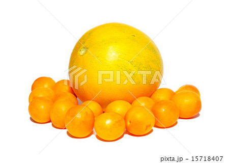 Yellow plums and the melon isolated on white. 15718407
