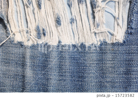 Closeup of tear in old jeans. 15723582