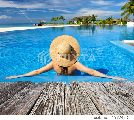 Woman at poolside Woman at poolside 15724539