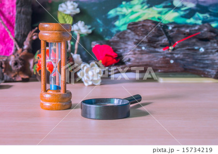 Hourglass and magnifying 15734219