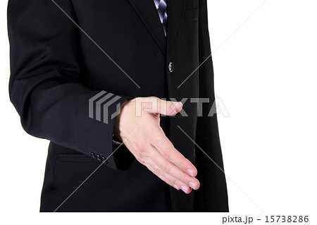 Businessman Holds out his Hand for a Handshake. Isolated Businessman Holds out his Hand for a Handshake. Isolated 15738286
