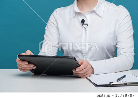 Beautiful girl tv newscaster reports holding notebook 15739787