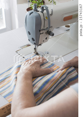 Women sew on sewing machine 15743167