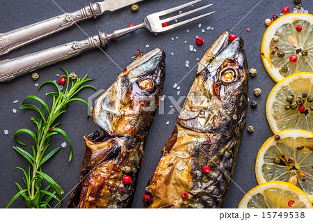 Baked Mackerel Fish with Herbs and Lemon on Stone Baked Mackerel Fish with Herbs and Lemon on Stone 15749538