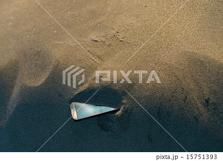 Smartphone lost in the sand 15751393
