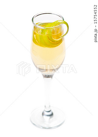 Yellow cocktail in glass with lemon twist 15754552