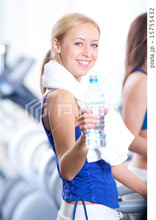 Women drinking water after sports Women drinking water after sports 15755432