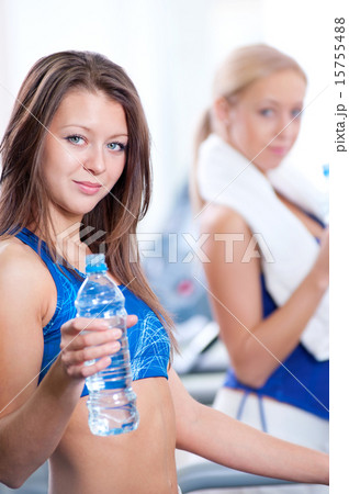 Women drinking water after sports Women drinking water after sports 15755488
