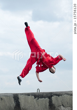 Wushoo man in red practice martial art Wushoo man in red practice martial art 15756120